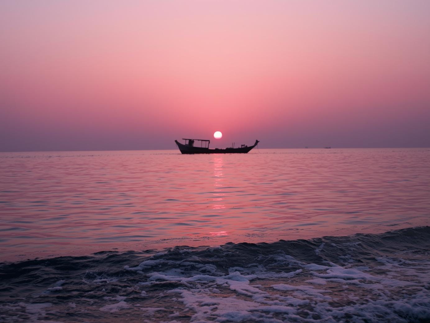 A tranquil Ko Phayam sunrise paints the sky in pastel hues, signaling the start of an unhurried day.